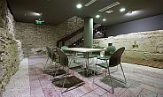 meeting room surrounded by the remains of a medieval water-tower - Hotel Lanchid 19 in Budapest